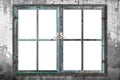 Very aged wooden window frame with cracked paint on it, mounted on a grunge wall Royalty Free Stock Photo