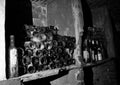 Very ancient bottles of wine lies in retro dark cellar