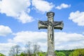 Very ancient stone statue of crucifixion of Jesus Christ as a symbol of resurrection and immortality of the human soul