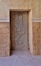 A very ancient wooden door in the wall of an ancient building in Jerusalem