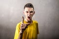 Very angry boy yelling showing finger Royalty Free Stock Photo