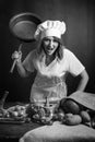 Very angry chef with big frying pan in hand Royalty Free Stock Photo