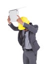 Very angry engineer is throwing away his laptop isolated on whit Royalty Free Stock Photo