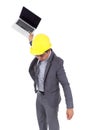 Very angry engineer is throwing away his laptop isolated on whit Royalty Free Stock Photo