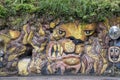 Lion graffiti on natural overgrown rock face, Barbedos.