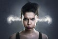 Very angry woman with smoke coming out of her ears Royalty Free Stock Photo