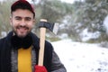 Very attractive lumberjack in the snow Royalty Free Stock Photo