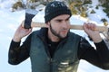 Very attractive lumberjack in the snow Royalty Free Stock Photo