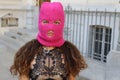 Very attractive woman wearing a neon pink balaclava