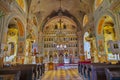 A very beautiful church inside with an altar set with icons, with painted holy walls and frescoes and paintings on the