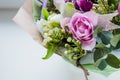 Very beautiful colorful blossoming flower bouquet of fresh Quicksand roses, carnations, ranunculus, peony, branches with Royalty Free Stock Photo