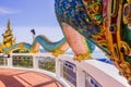 A very beautiful Naga a very great serpent statue surrounding the pagoda at Doi Thepnimit temple on Patong hilltop Royalty Free Stock Photo