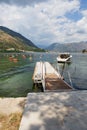Very beautiful promenade of the Bay of Kotor, a small fishing boat. Montenegro. Beautiful and cozy city, Kotor embankment. The