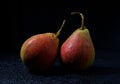 Very beautiful ripe pear on a black background Royalty Free Stock Photo