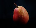 Very beautiful ripe pear on a black background Royalty Free Stock Photo