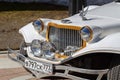 Very beautiful, sparkling in the sun car Packard limousine of white color. Fore view