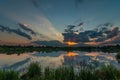 Very beautiful summer sunset over the lake with reflection on water Royalty Free Stock Photo