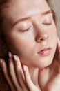 Beautiful teenage girl washed her face and closed her eyes. Young skin care concept. Shot in a studio closeup, vertical Royalty Free Stock Photo