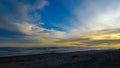 A very beautiful view of the beach with a golden sunset at the end of the day Royalty Free Stock Photo