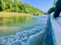 Very beautiful green nature with blue sky and speed boat overflow water Royalty Free Stock Photo