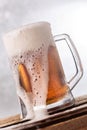 Very big beer mug over flow closeup Royalty Free Stock Photo