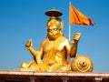 Big Statue of Hindu God Hanuman in Golden Color Shining in Sunshine