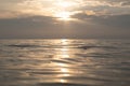 A very calm Baltic sea water surface with reflections of the sun.