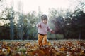 Very cheerful child having fun while tossing up