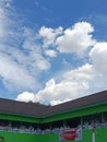 The sky is clear over the school building
