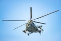 Very close frontal view of an attack helicopter against the sky, with missiles, rockets and machine gun. Military Royalty Free Stock Photo