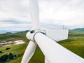 A very close-up of the rotor and wind turbine blades. Royalty Free Stock Photo