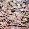 Very close up of the succulent and typical Italian dish Pizzoccheri in a white plate on a table. Typical dish from Valtellina,