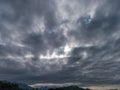 Very cloudy sky with some sun rays through it Royalty Free Stock Photo