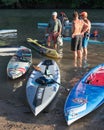 Very colorful paddle boards and 3 racers Royalty Free Stock Photo