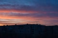 Very colorful sunset over a multi-storey building in the city of Orenburg