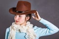 Very cute girl with pinned hair in a cowboy hat