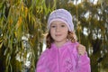 Very cute little girl in a pink blouse