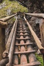 Very dangerous trail along wooden ladders in the southeast of Austria in the Fischbach Alps to top of the Hochlantsch through