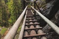 Very dangerous trail along wooden ladders in the southeast of Austria in the Fischbach Alps to top of the Hochlantsch through