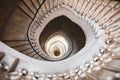 Very deep descending spiral staircase Royalty Free Stock Photo