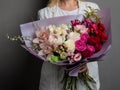 Very delicate handmade bouquet in the hands of the girl florist, a great gift, fresh and neat, interesting gradient Royalty Free Stock Photo