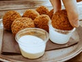 Dip the fried boudin balls in a sauce Royalty Free Stock Photo