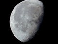 very dense close-up of a decreasing moon in the night sky