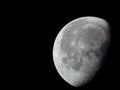 very dense close-up of a decreasing moon in the night sky