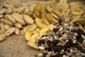 Very detailed view of dried bananas, chocolate beans and almonds