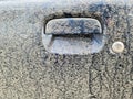 A very dirty car handle at a black car door Royalty Free Stock Photo