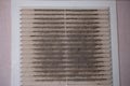 Very dirty and dusty white plastic ventilation grill. Ventilation shaft in the apartment. dirty air filter. House cleaning concept