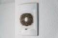 Very dirty and dusty white plastic ventilation grill. Ventilation shaft in the apartment. dirty air filter. House cleaning concept Royalty Free Stock Photo