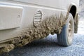 Very dirty muddy van after driving the endless Dalton Highway leading from Fairbanks to Prudhoe Bay, Alaska, USA Royalty Free Stock Photo