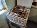 Very dirty and old gas stove and frying pan on the kitchen Royalty Free Stock Photo